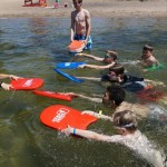 Group of campers learning to swin